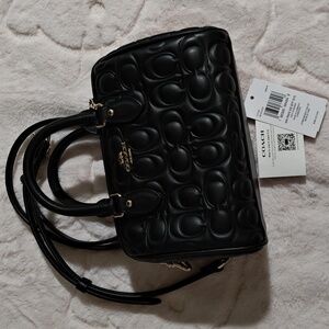 Coach Black Leather Quilted Mini Rowan Embossed In Signature Print
